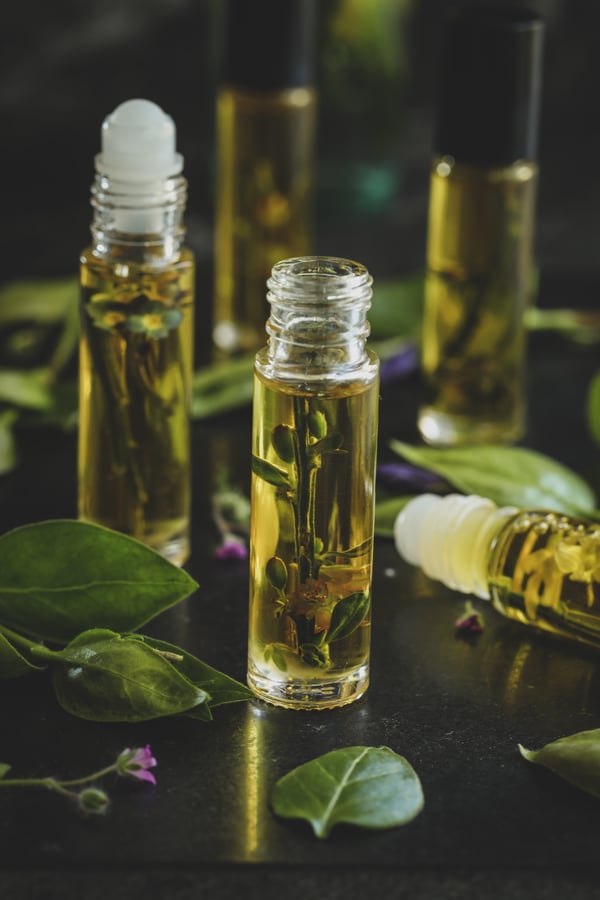 Perfume infusing in roll top bottles