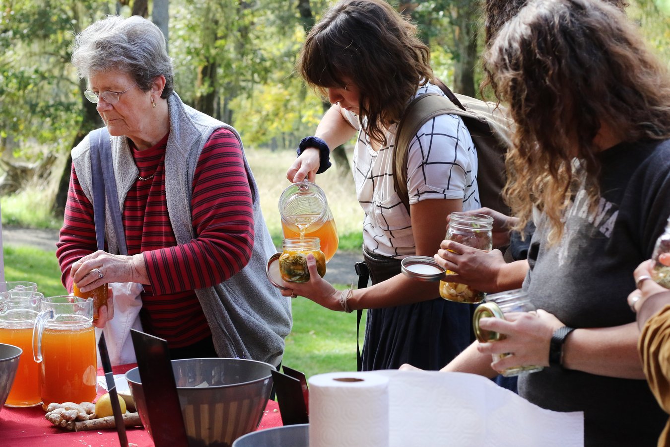 Community members pouring tea