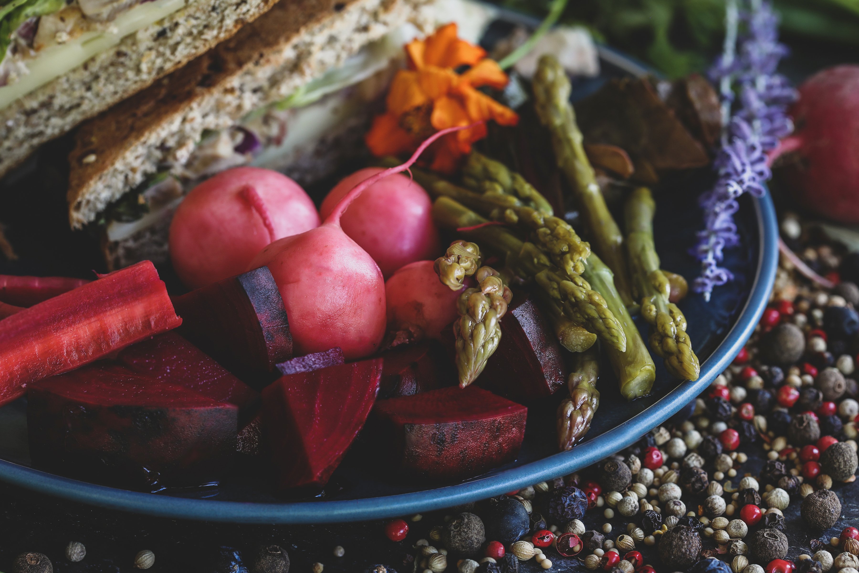 Colorful pickled vegetables and spices on a plate. 