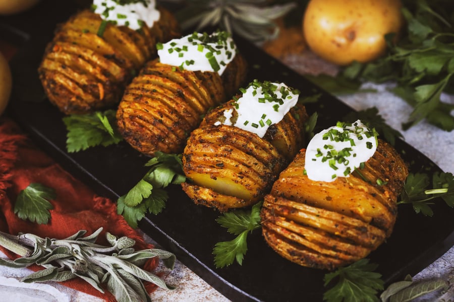 Hasselback Potatoes with chives and sour cream.