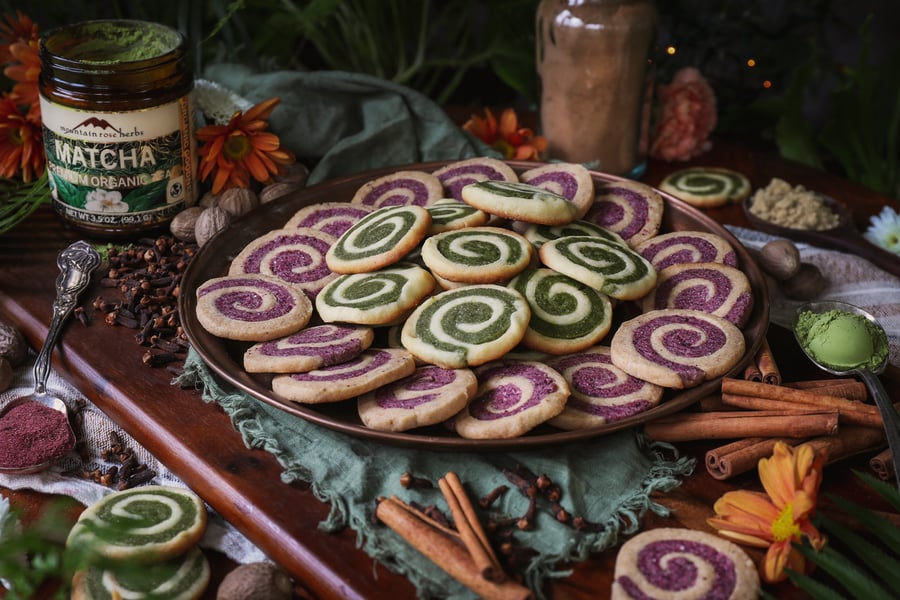 Herbal pinwheel cookies with matcha and hibiscus.