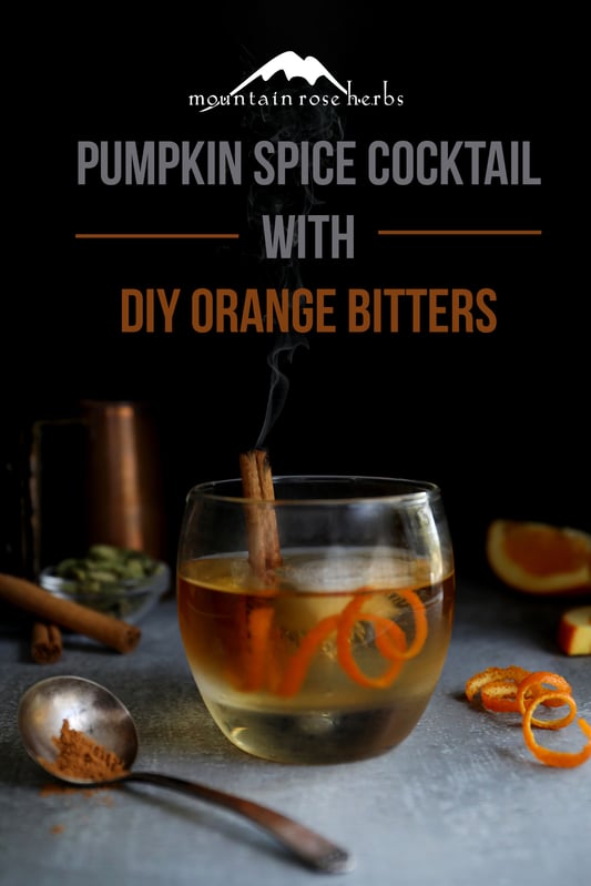 Pinterest link to Mountain Rose Herbs. Pumpkin pie spice Old Fashioned in a lowball garnished with a smoking cinnamon stick and orange rind.