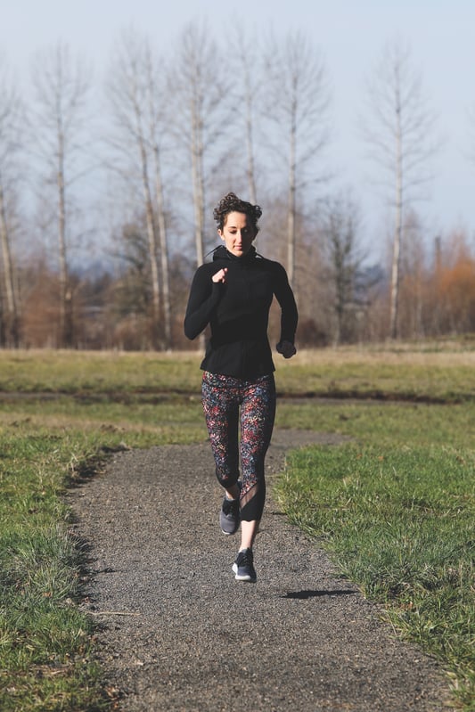 Fit young woman running on a bath. 