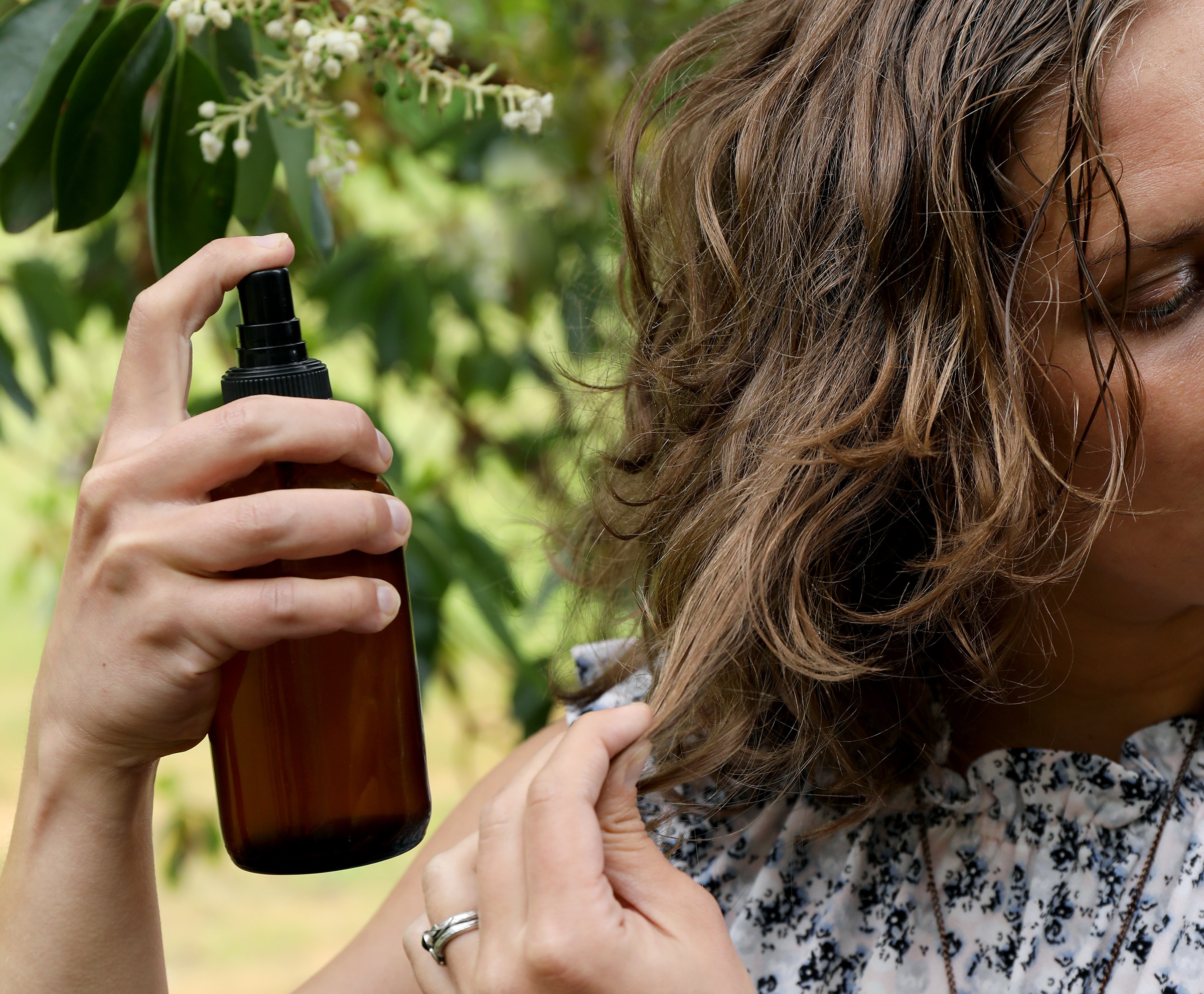 Homemade salt spray with essential oils and hydrosols for styling hair naturally. 