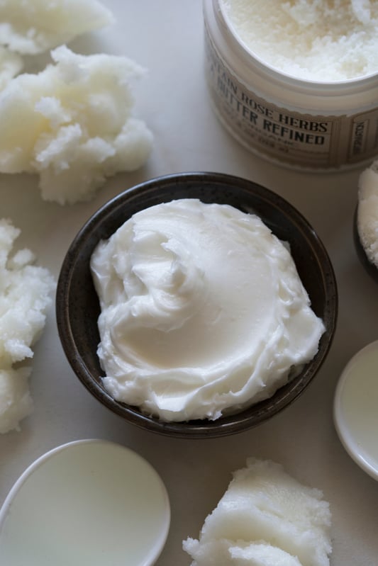 Bowl of homemade whipped shaving cream on counter with organic butters and ingredients Bowl of homemade whipped shaving cream on counter with organic butters and ingredients