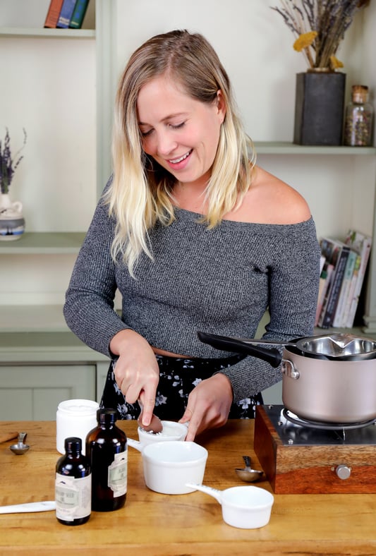 Young woman making a DIY skin care recipe. 