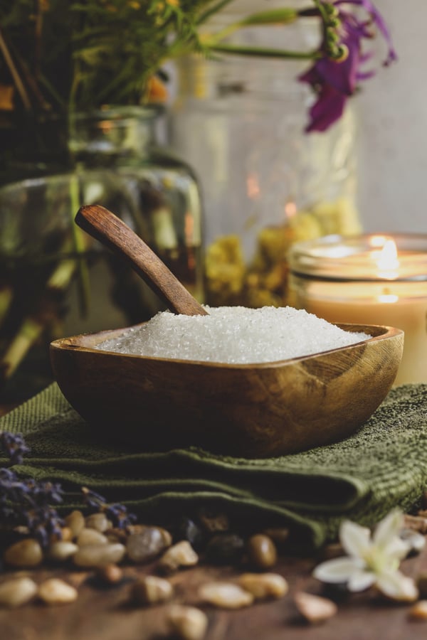 A bowl of Epsom salt ready to be mixed into an herbal sitz bath.