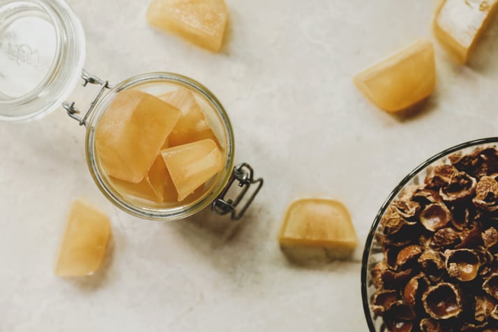 Adorable homemade soap nut laundry bricks sit in a jar