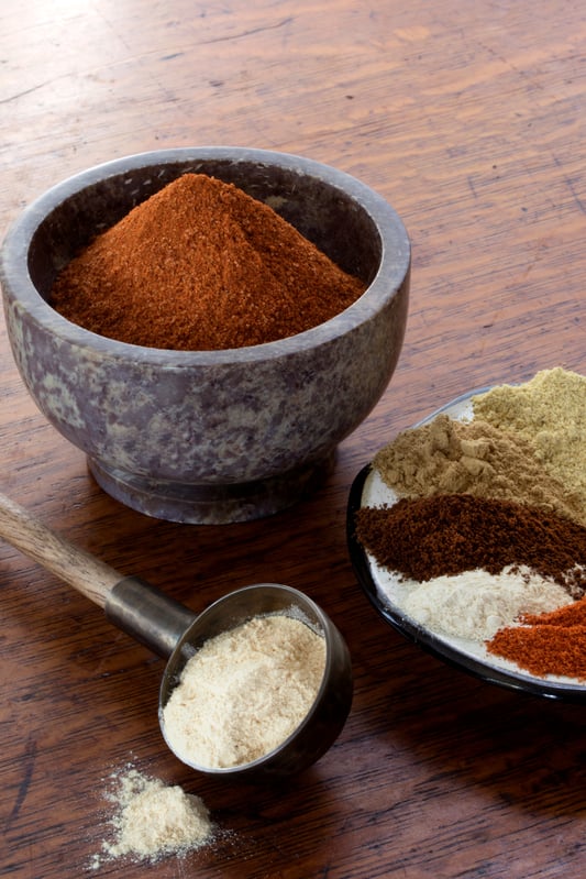 World Spice Blend Ethiopian Berbere In A Mortar With Ingredients In A Plate 