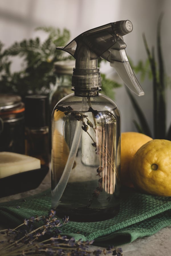 A spray bottle filled with DIY surface spray.