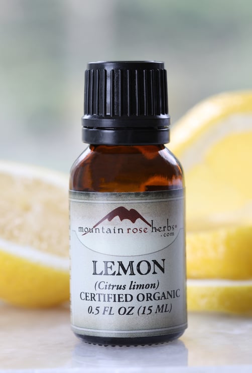 Half ounce glass amber bottle of lemon essential oil for spring cleaning