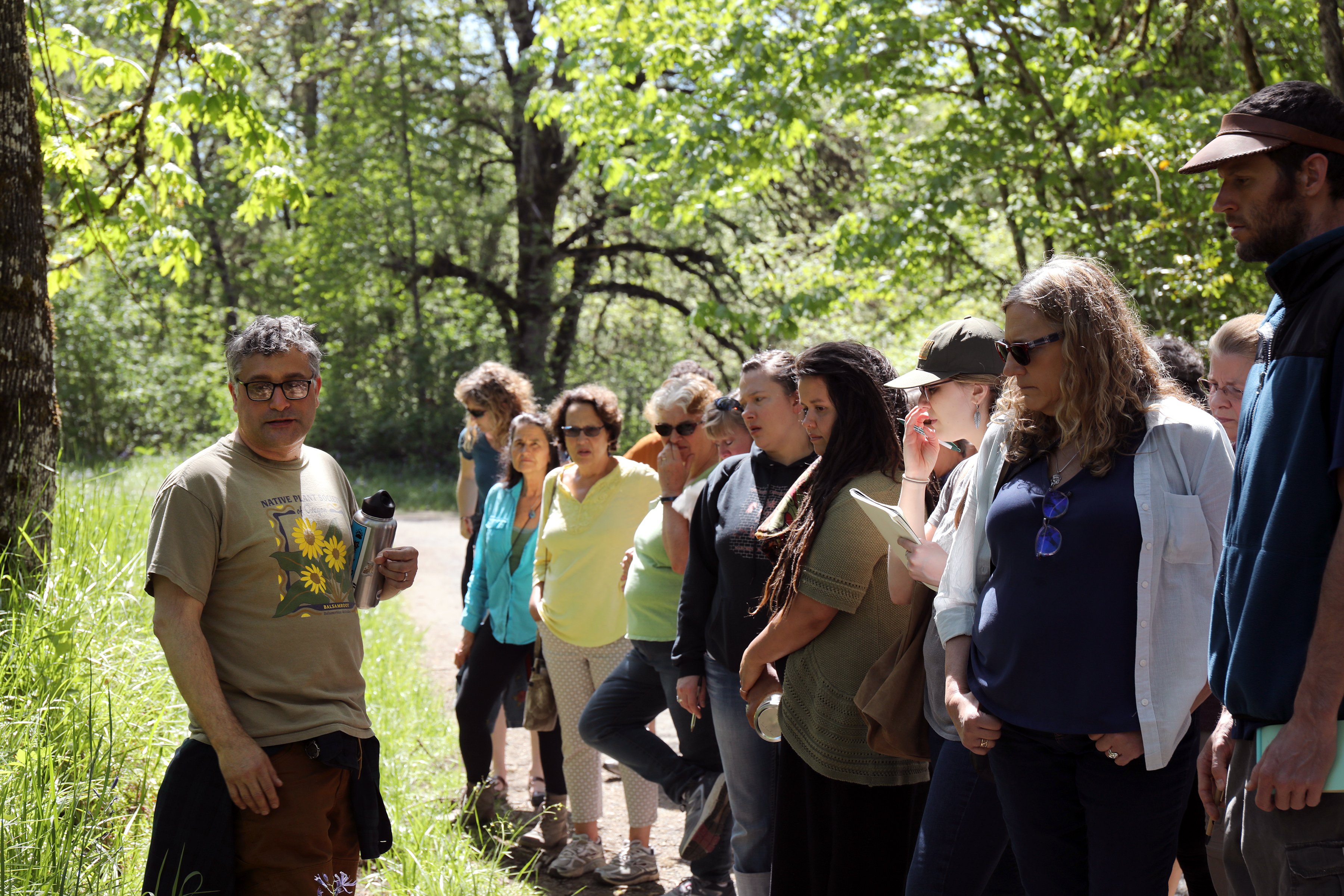 Quality control director, Steven Yaeger, takes participants on a plant identification walk in natural areas in Eugene, Oregon. Identifying plants is important to the botanical trade. 