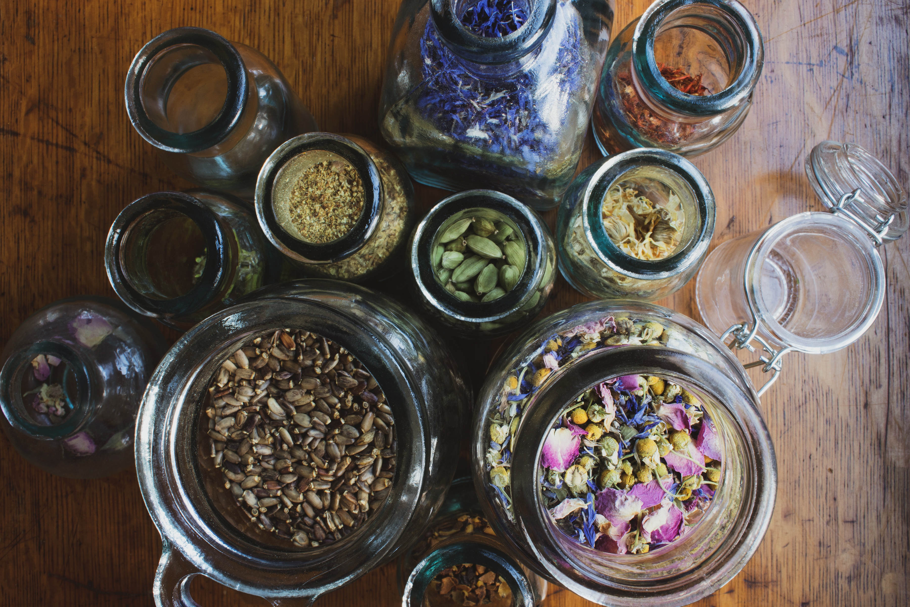 herbs in open glass jars