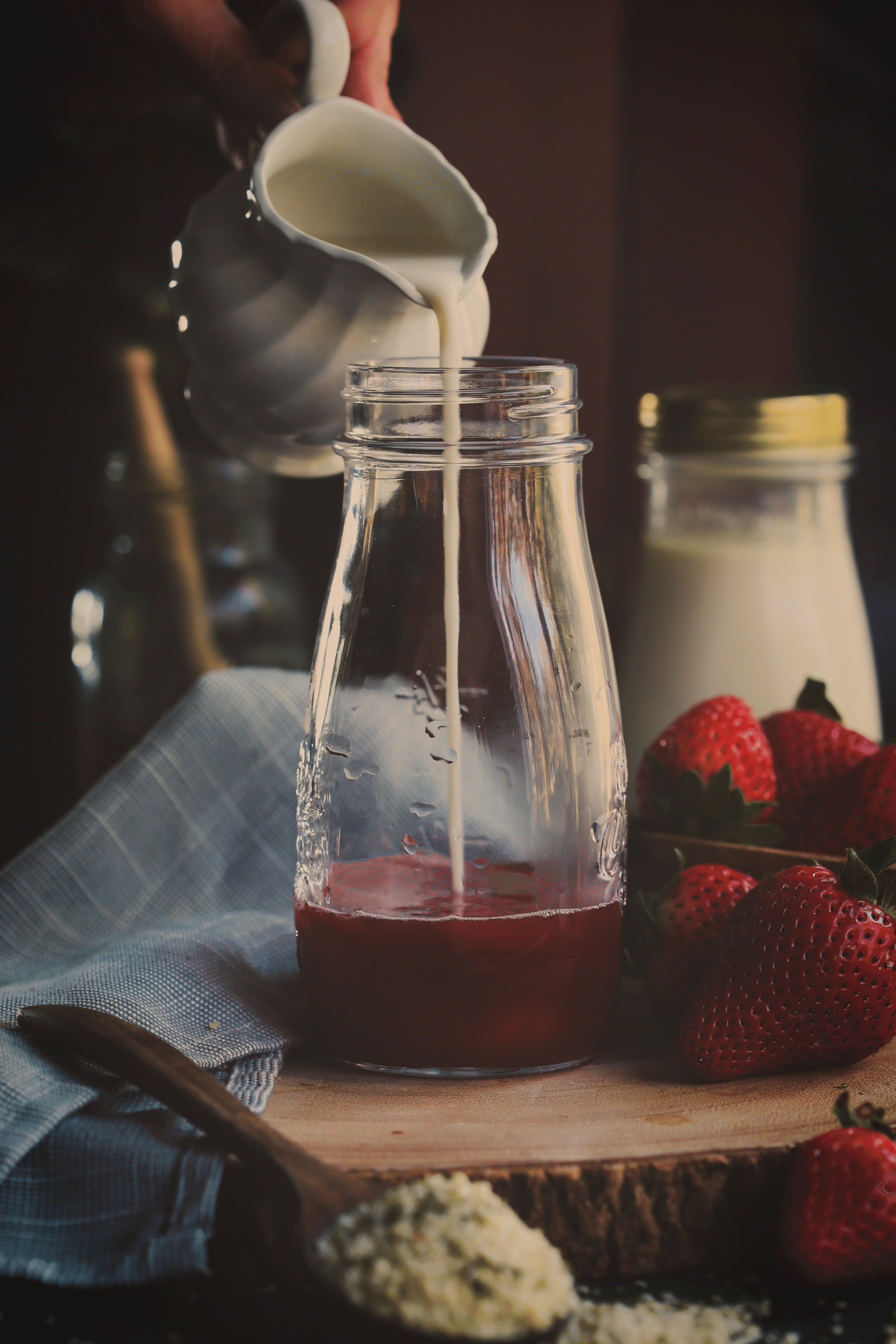 Strawberry hemp milk being poured