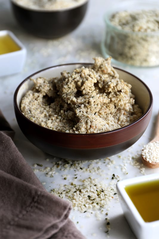 A bowl of diy organic tahini spread made with hemp seeds, sesame seeds, pumpkin seed oil, and sesame seed oil.