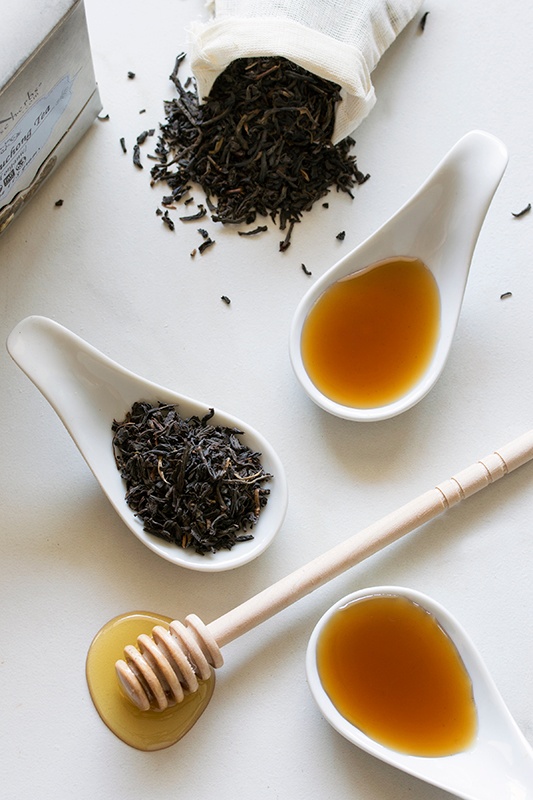 Spoonfuls of lapsang souchang tea, honey, and syrups