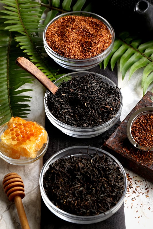 The top 3 teas offered by Mountain Rose Herbs are organic red rooibus, organic Earl Grey, and organic and fair trade assam black tea. These teas are sustainably harvested and offer a range of flavor profiles perfect for morning, noon, and night.