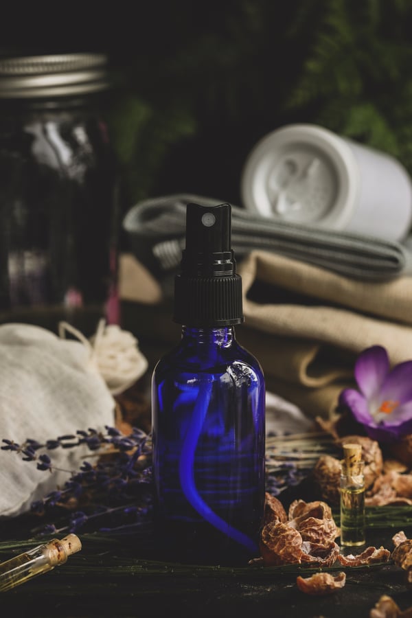 Blue spray bottle with natural ingredients 