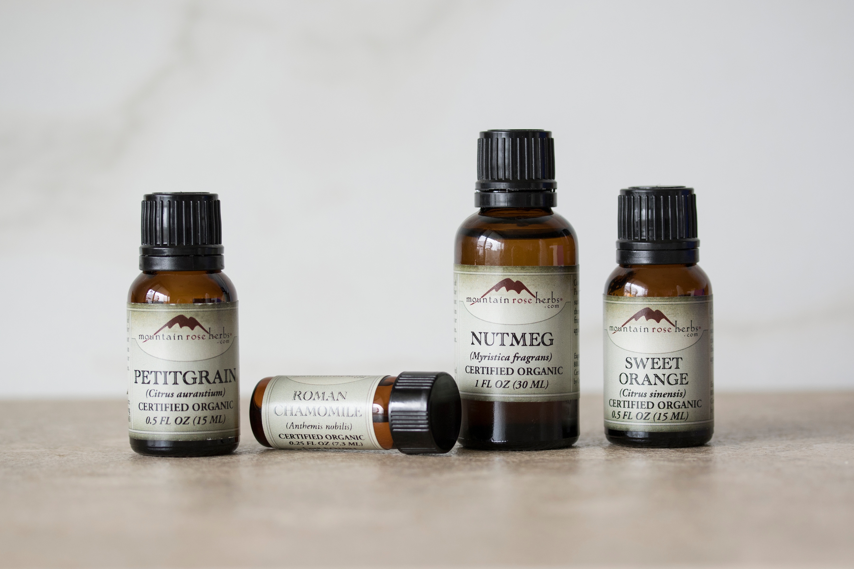 Bottles of essential oils in warm setting