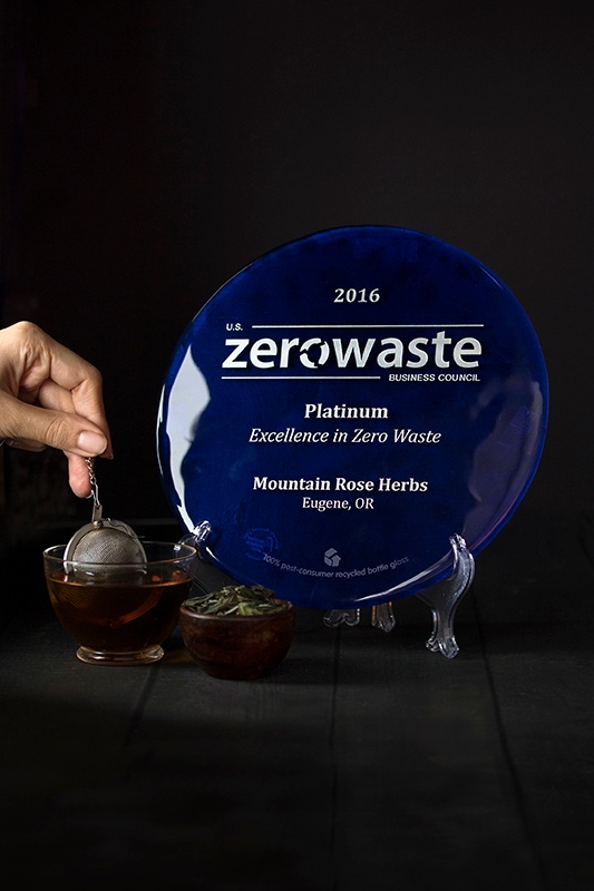 hand steeping organic tea next to zero waste platinum award
