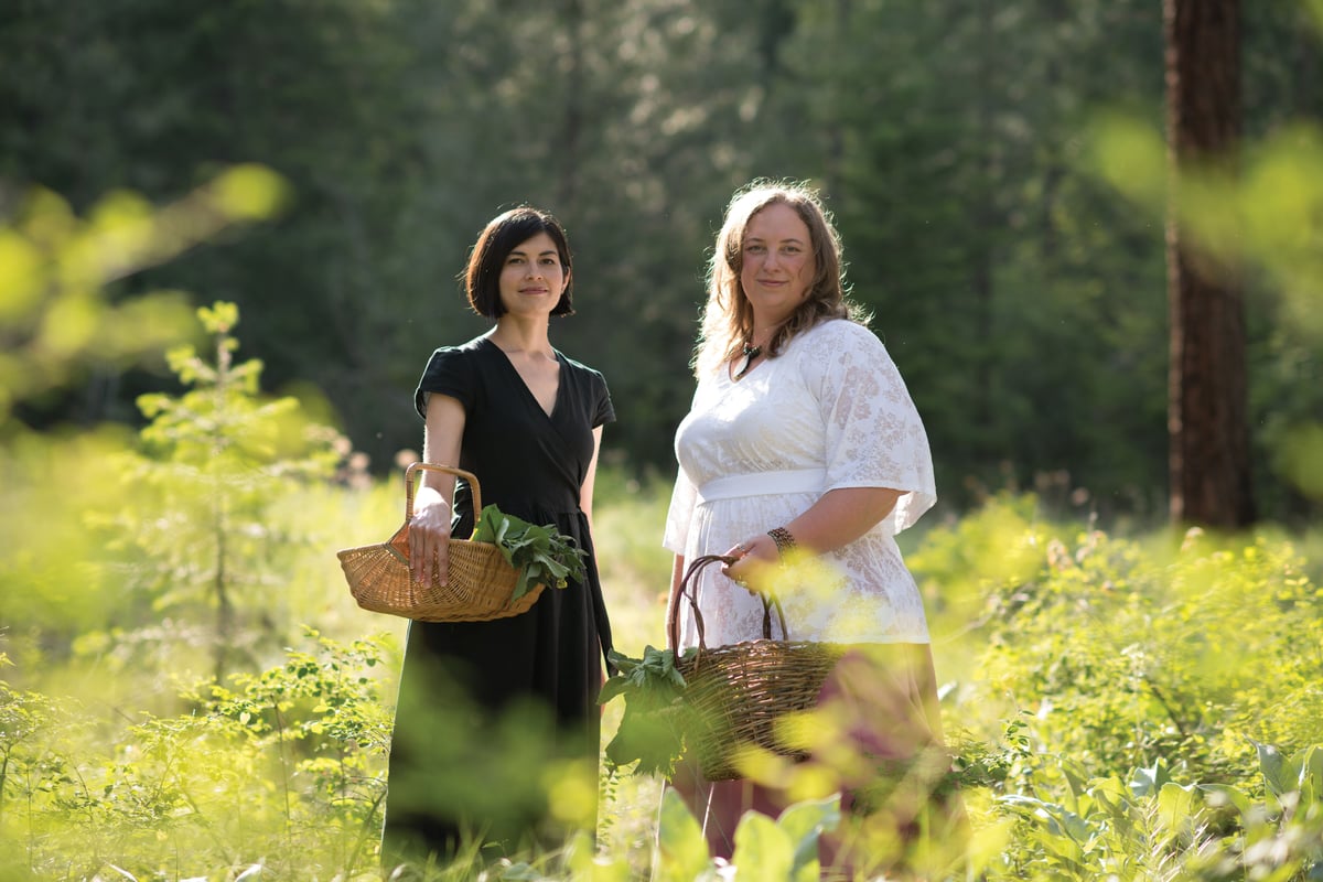 Authors Rosalee de la Foret and Emily Han wildharvesting ingredients for herbal recipes.