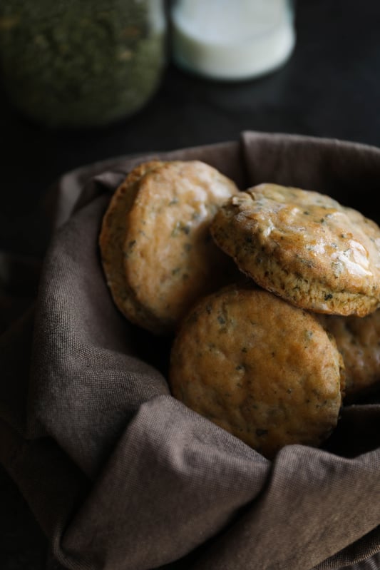 A basket of fresh biscuits baked with nettle and garlic. Herbal biscuits with spring nettle. 