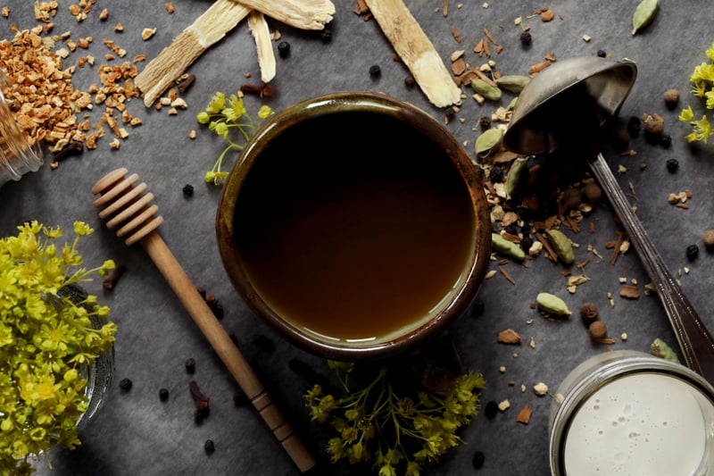 Cup of brewed homemade chai tea with astragalus root.