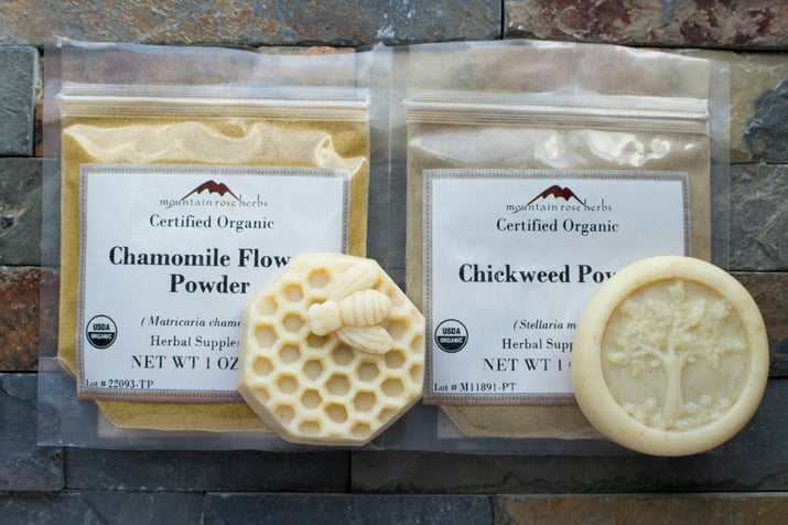 Sealed bags filled with Mountain Rose Herbs chamomile flower powder and chickweed powder