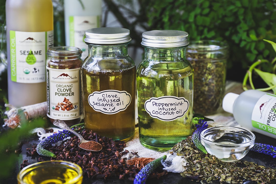 Glass jars with herb -injected oils in oil attraction. 